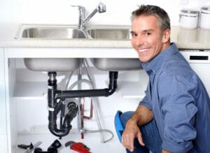 lyndhurst nj plumber works on a broken sink