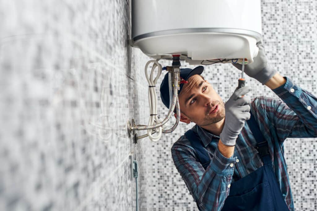 Garfield Man repairing boiler